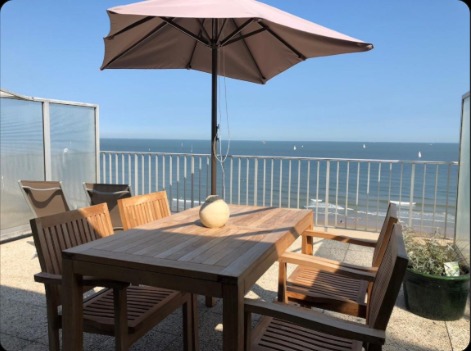 Illustrative seaside terrace overlooking the sea